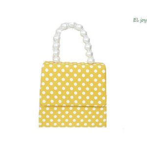 Clutch amarillo lunares