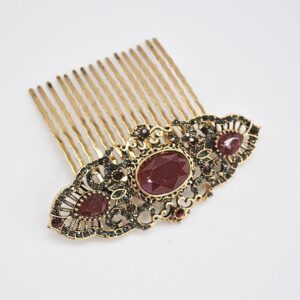 Peineta dorada piedras granates