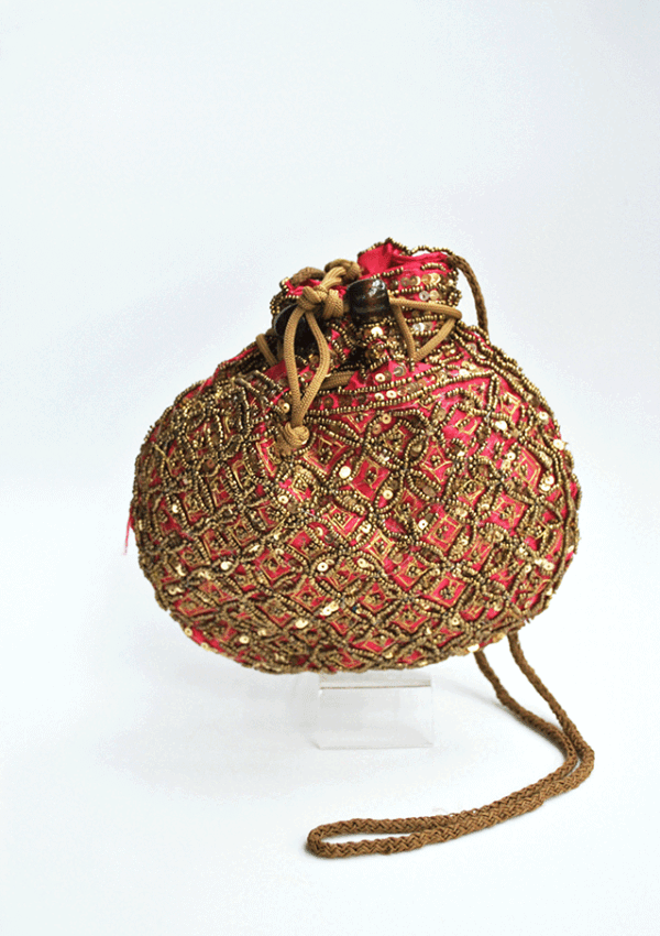 Bombonera fucsia y dorada