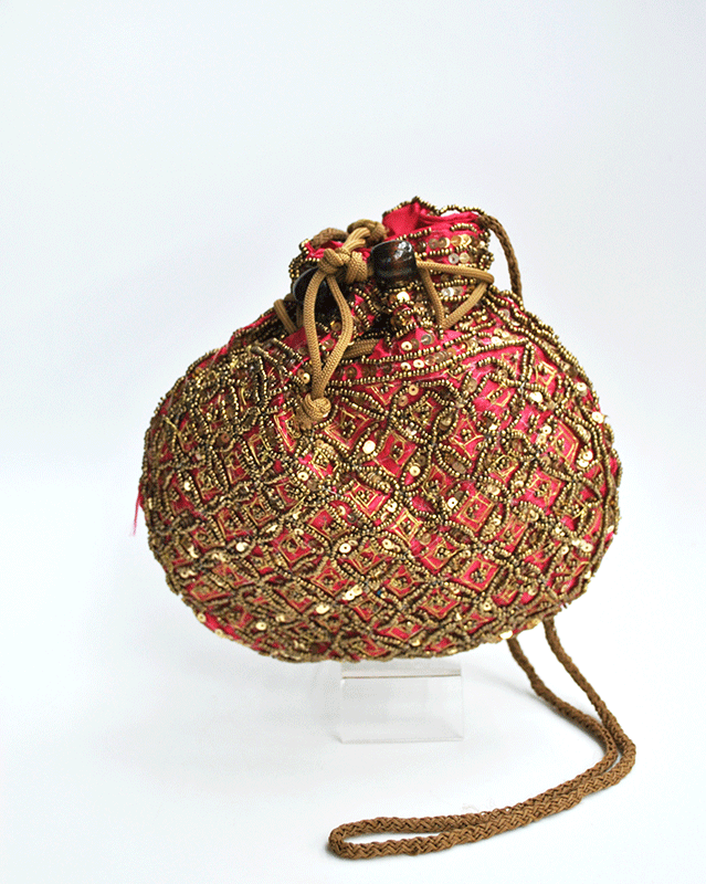 Bombonera fucsia y dorada