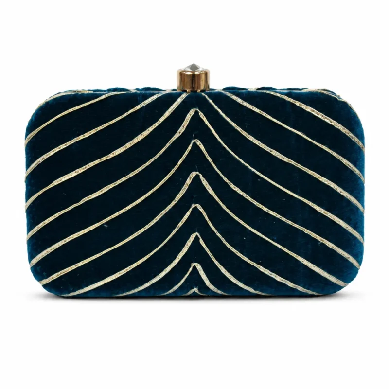 Clutch terciopelo petróleo