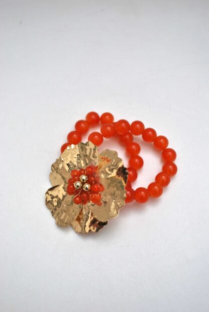 Brazalete naranja flor dorada