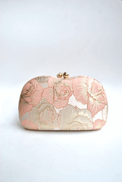 Clutch rosa y oro bordados