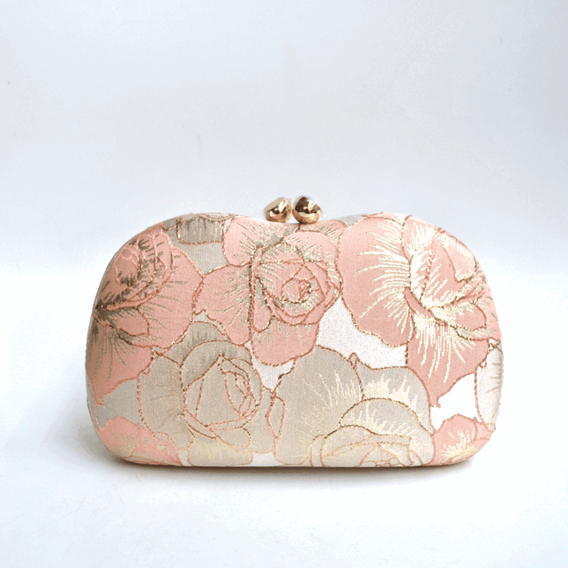 Clutch rosa y oro bordados