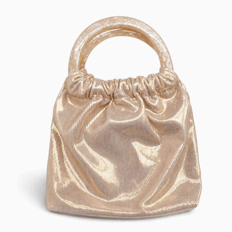 Bolso clutch oro rosa asas resina